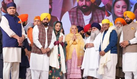 Punjab Chief Minister Bhagwant Mann and AAP leaders on stage during Shaheedi Diwas event, criticised for turning a solemn Sikh commemoration into a political showcase.